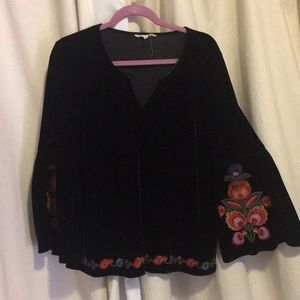 Black velour blouse flowers on sleeves and hem.